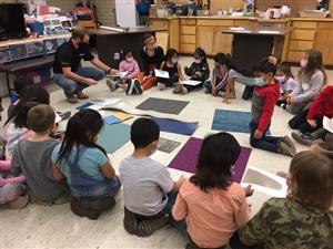 CORE Construction worker sharing materials with kindergartners